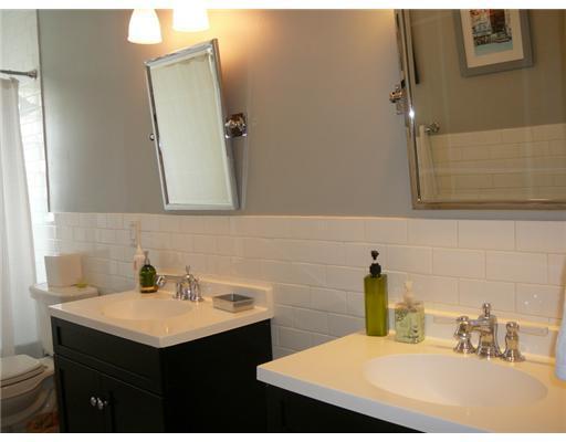 7149 Encina Lane Boca Raton, FL 33433 - Photo 13 of 22 a bathroom with a sink and a mirror