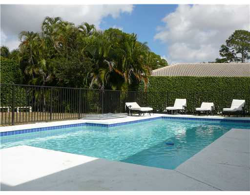 7149 Encina Lane Boca Raton, FL 33433 - Photo 8 of 22 a view of a swimming pool and lounge chair