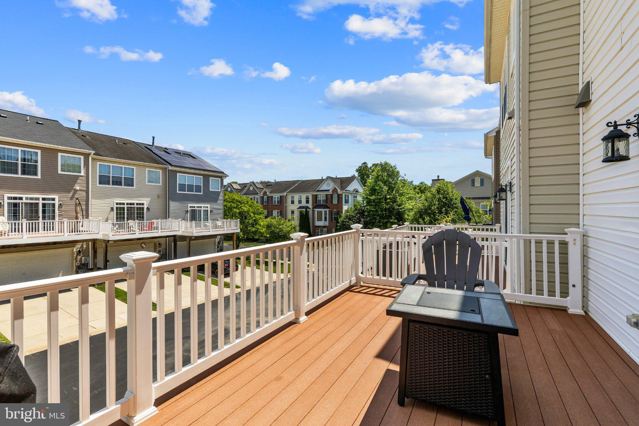 2668 Merlin Court Odenton, MD 21113 - Photo 10 of 42 a view of a deck with two chairs and wooden floor