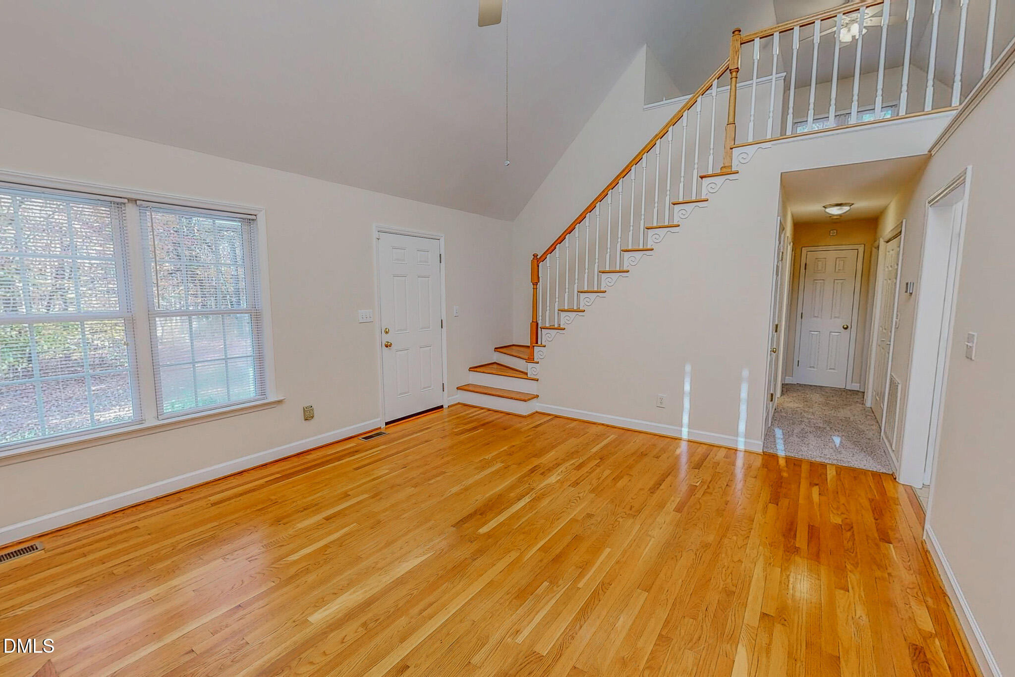 689 Lockamy Road Timberlake, NC 27583 - Photo 11 of 33 a view of an empty room with wooden floor and a window