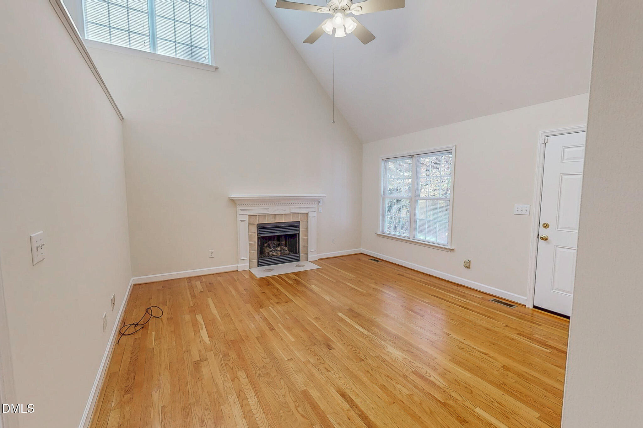 689 Lockamy Road Timberlake, NC 27583 - Photo 16 of 33 a view of empty room with wooden floor and fan