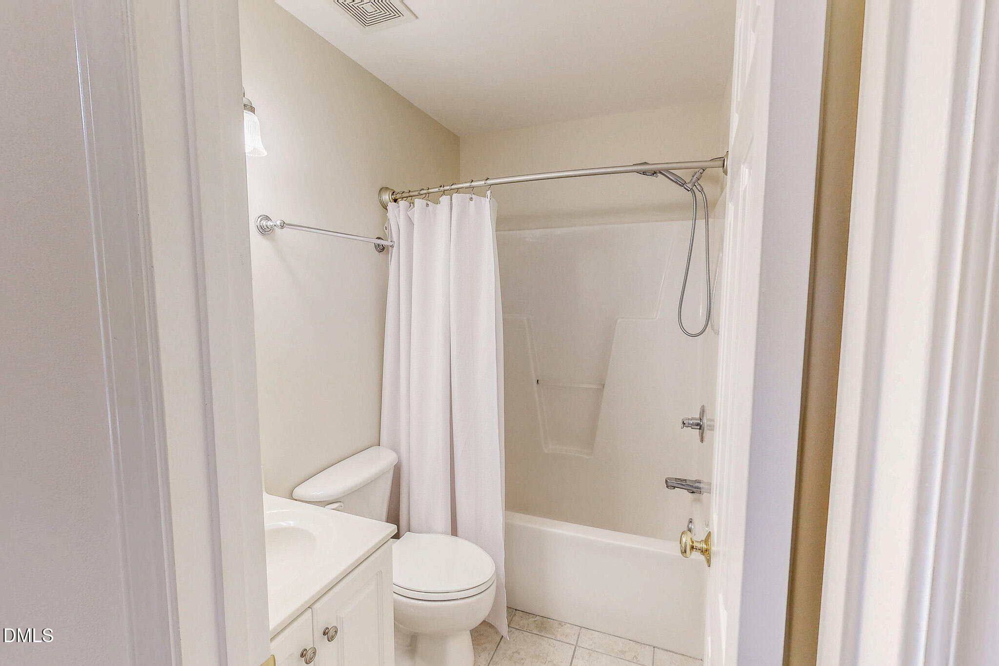 689 Lockamy Road Timberlake, NC 27583 - Photo 22 of 33 a bathroom with a shower a toilet and a shower