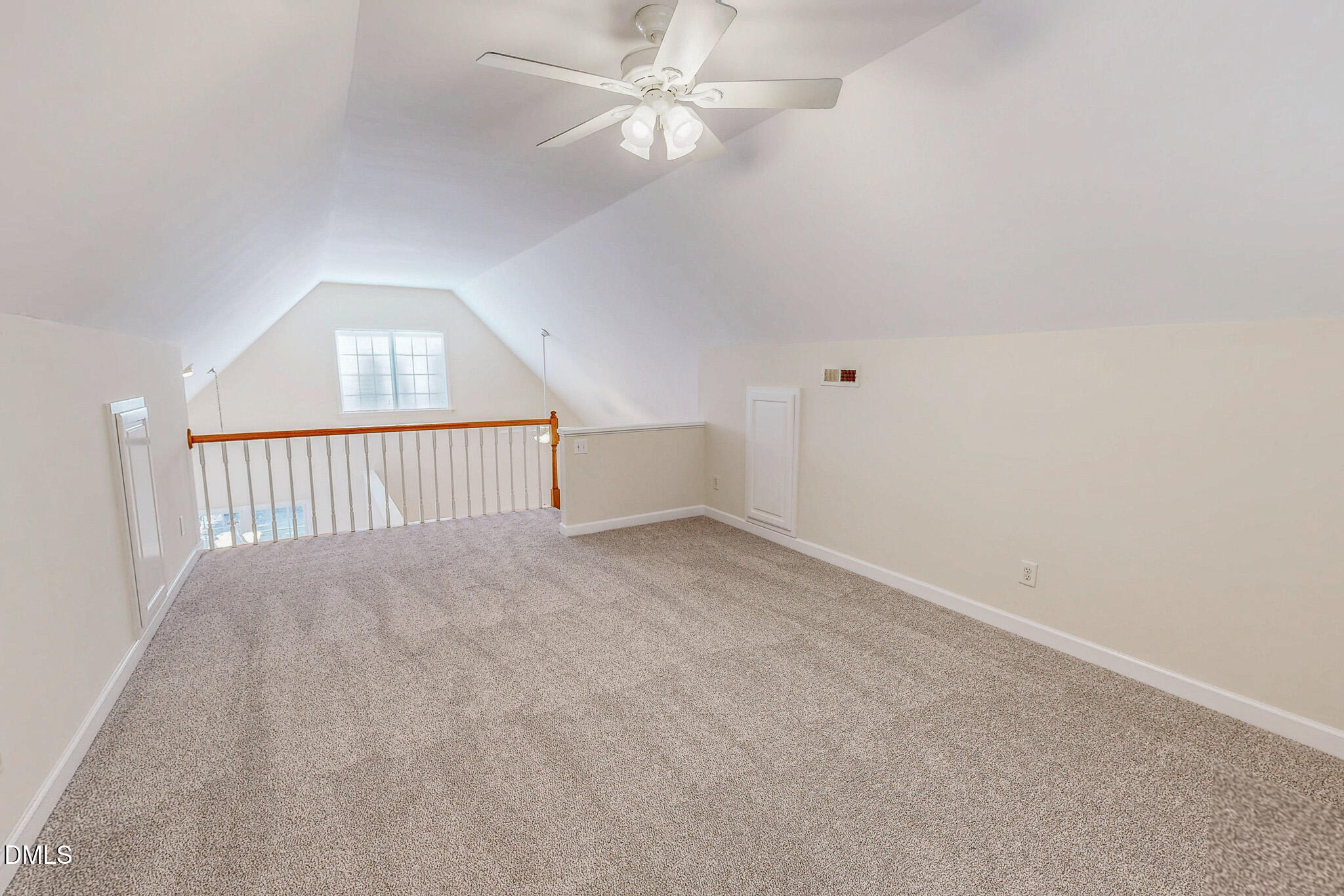 689 Lockamy Road Timberlake, NC 27583 - Photo 28 of 33 an empty room with a ceiling fan and windows