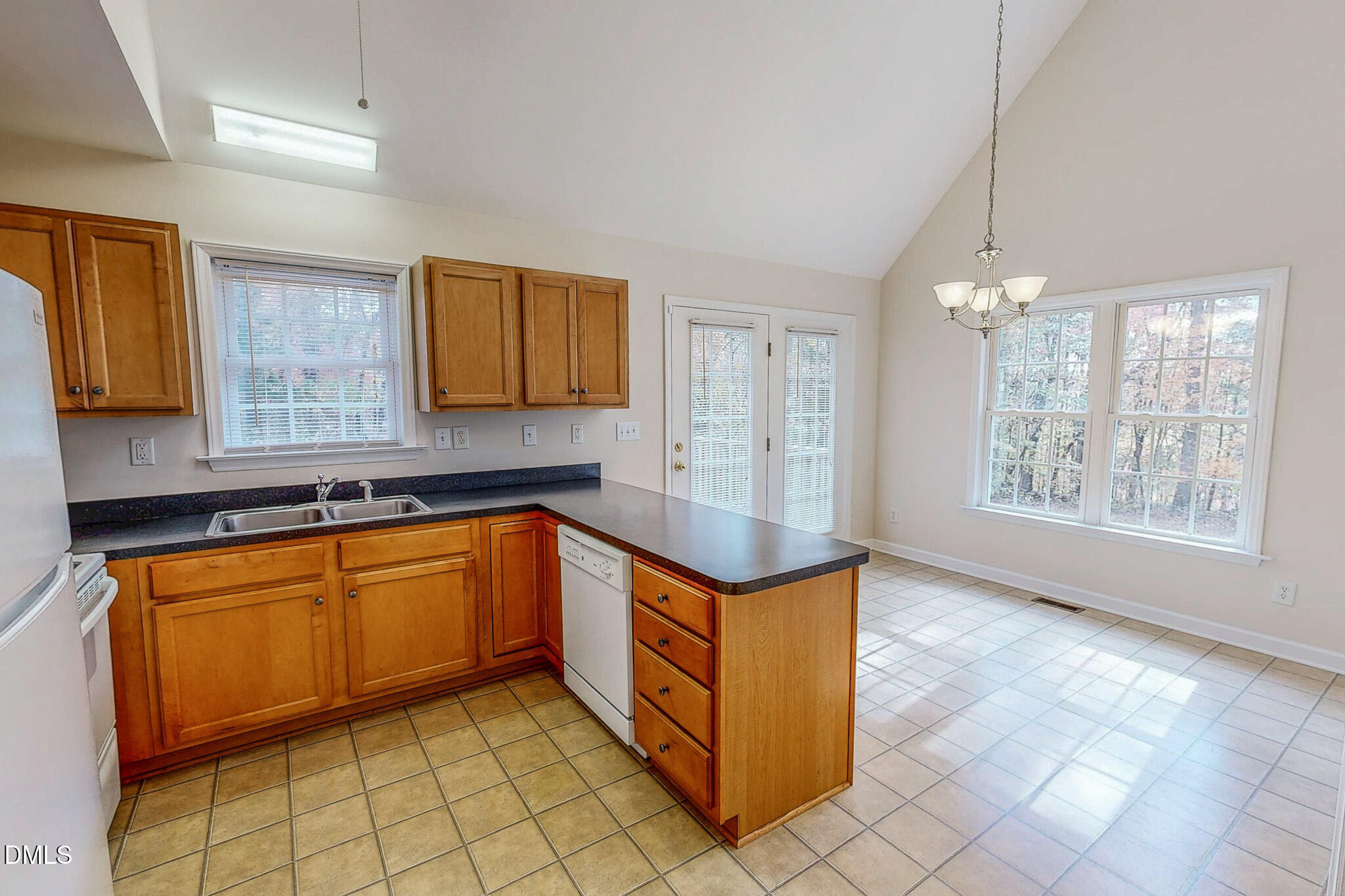 689 Lockamy Road Timberlake, NC 27583 - Photo 3 of 33 a kitchen with stainless steel appliances granite countertop a sink counter space cabinets and a window