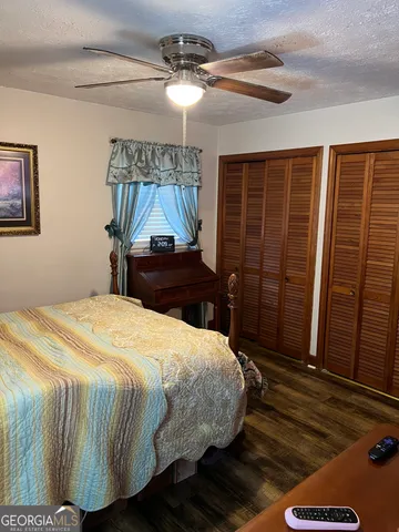 a bedroom with bed and a window