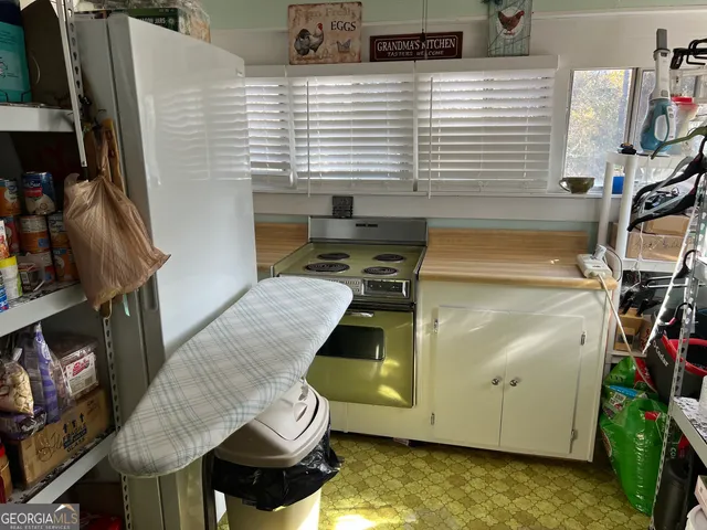 a backyard of a house with large trees