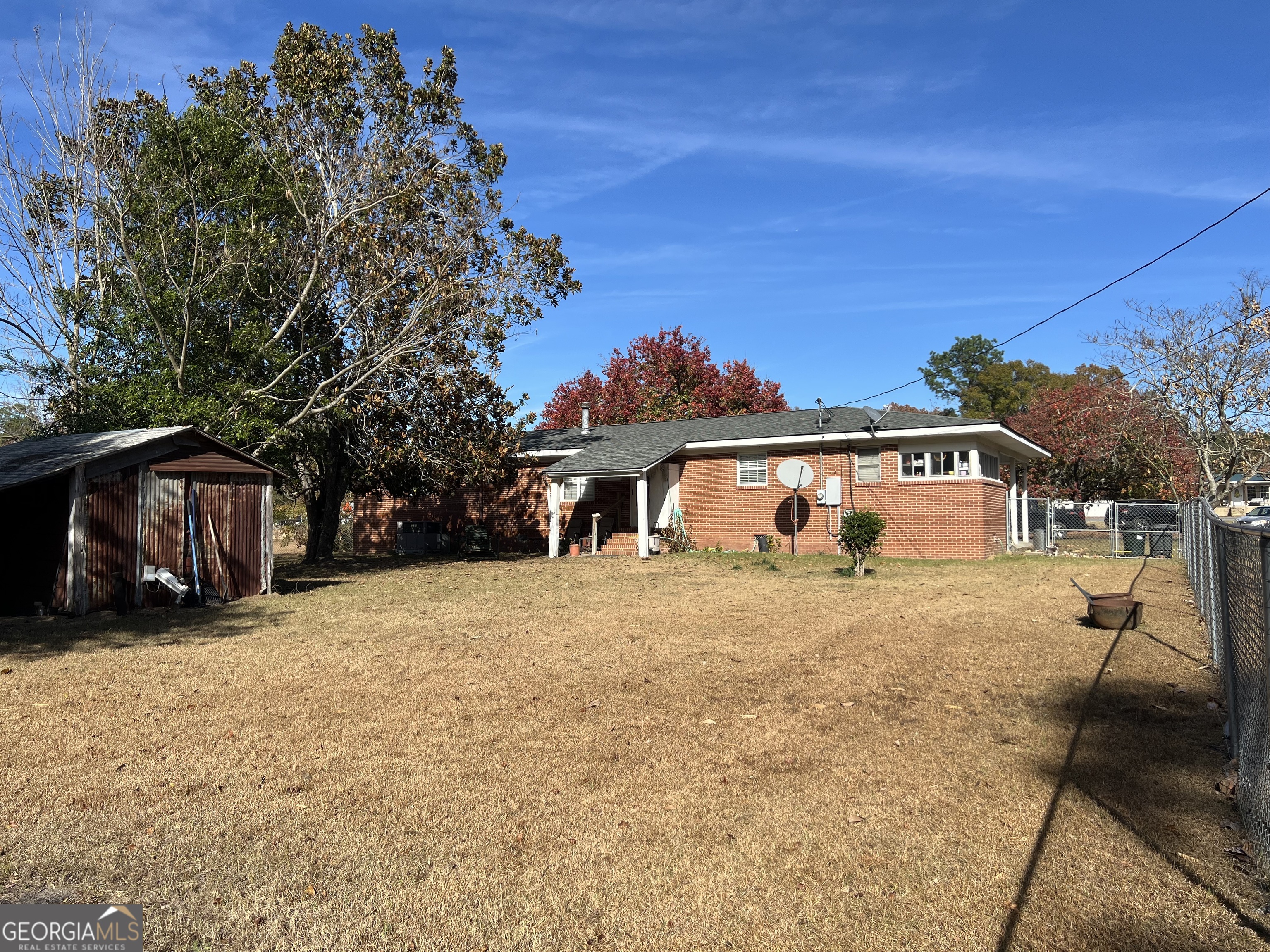 6419 Cochran Highway Cochran, GA 31014 - Photo 24 of 55 a front view of a house with a yard