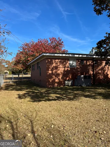 a view of a yard with a tree
