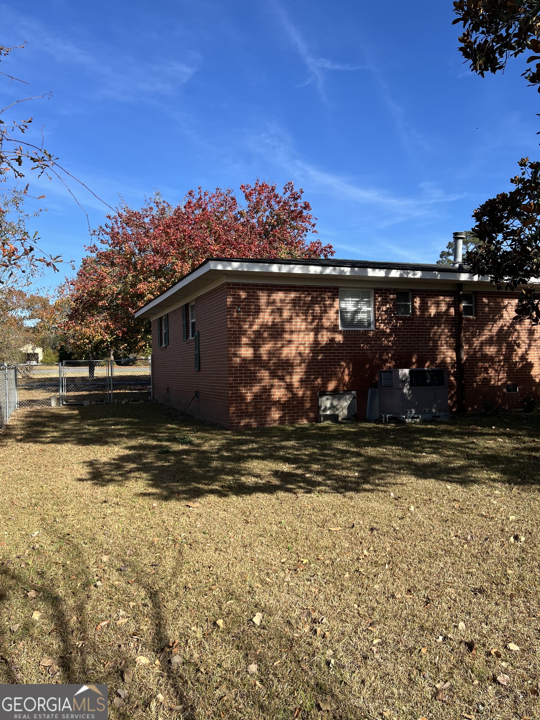 6419 Cochran Highway Cochran, GA 31014 - Photo 30 of 55 a view of a yard with wooden fence