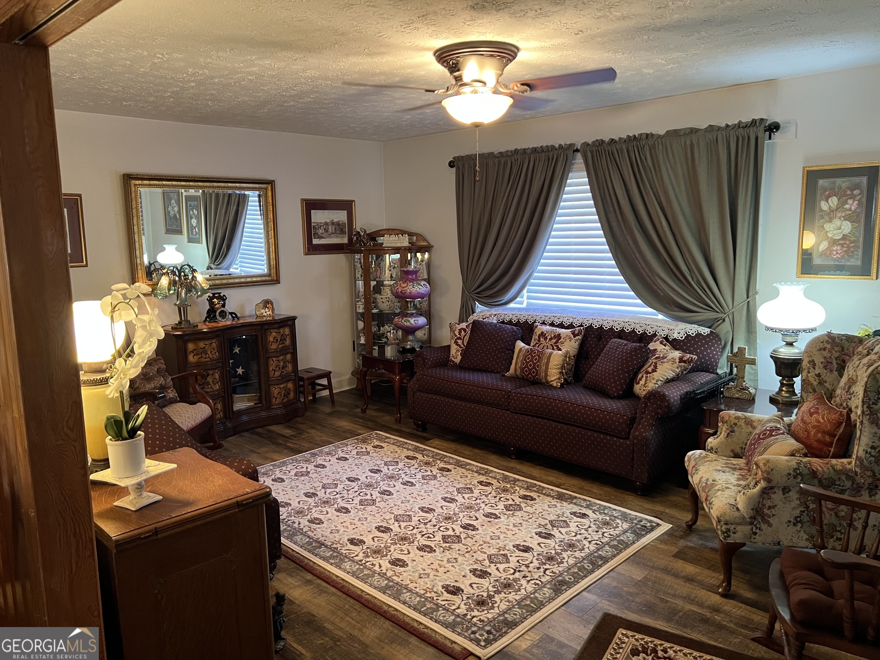 6419 Cochran Highway Cochran, GA 31014 - Photo 3 of 55 a living room with furniture and a wooden floor
