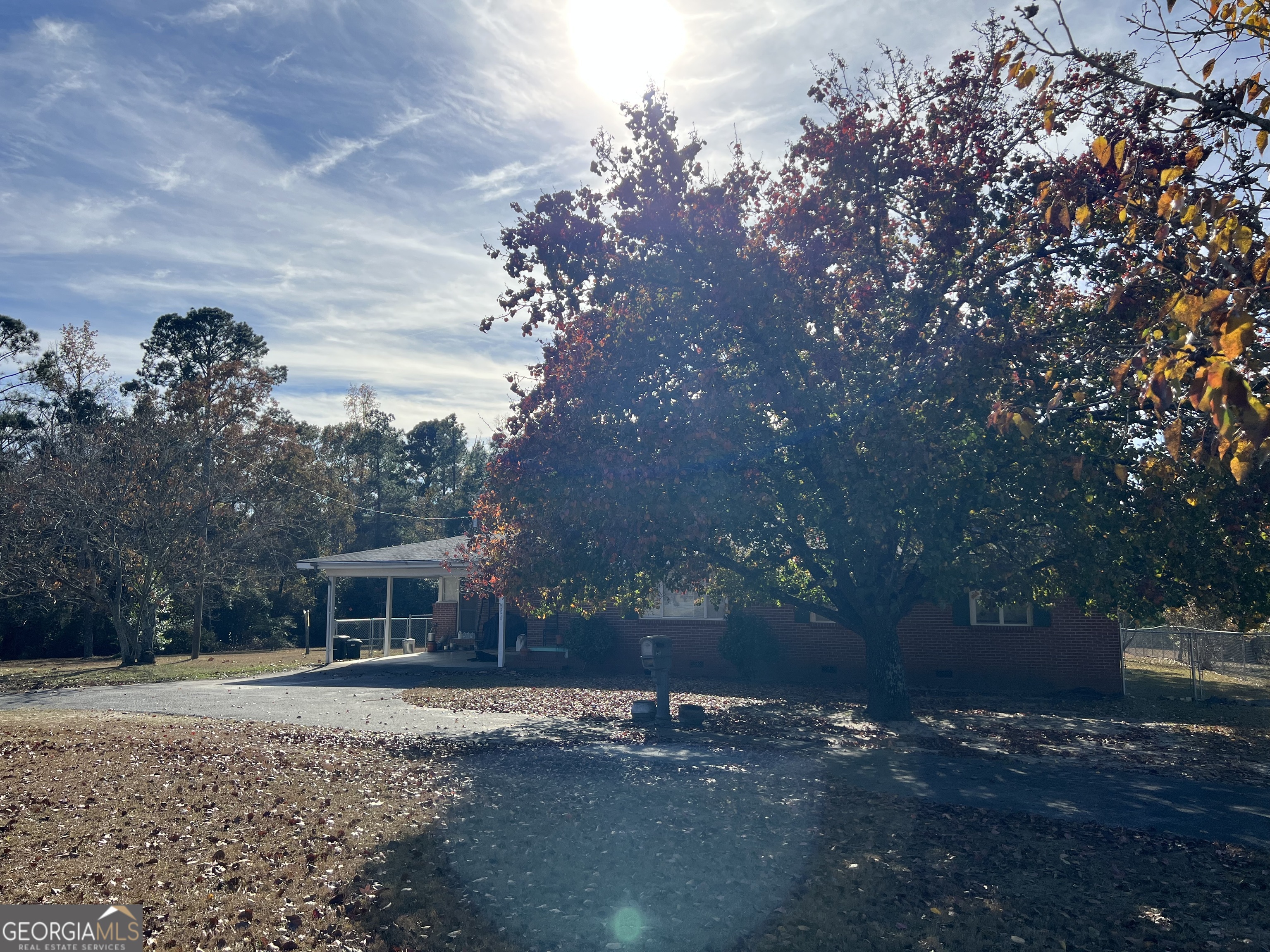 6419 Cochran Highway Cochran, GA 31014 - Photo 32 of 55 a front view of a house with a yard and trees