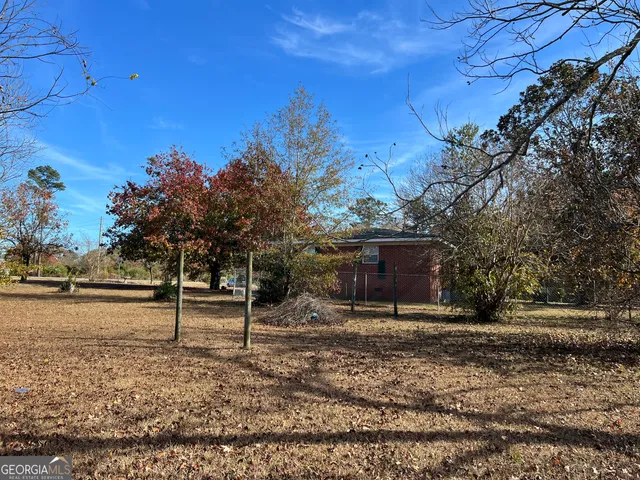 a backyard of a house with lots of green space