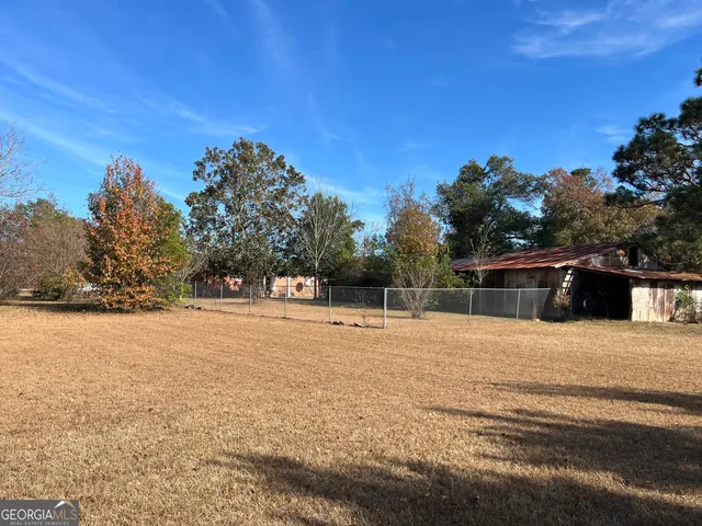 a front view of a house with a yard and a garage