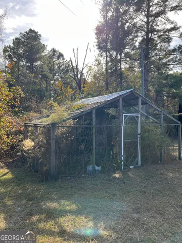 a backyard of a house with lots of trees