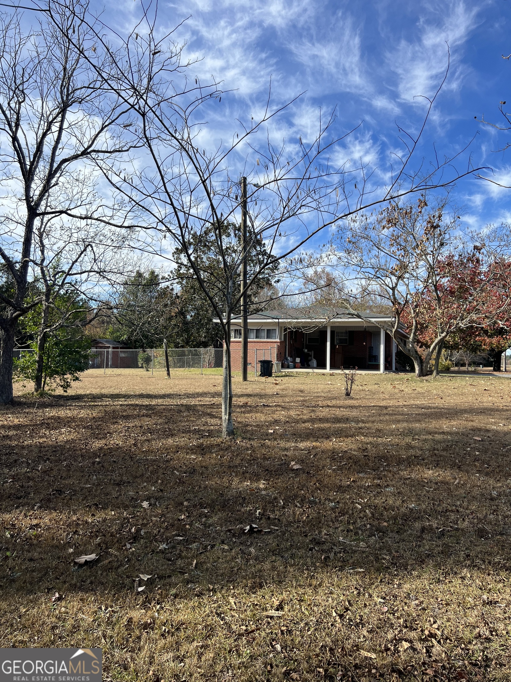 6419 Cochran Highway Cochran, GA 31014 - Photo 53 of 55 a front view of a house with a yard