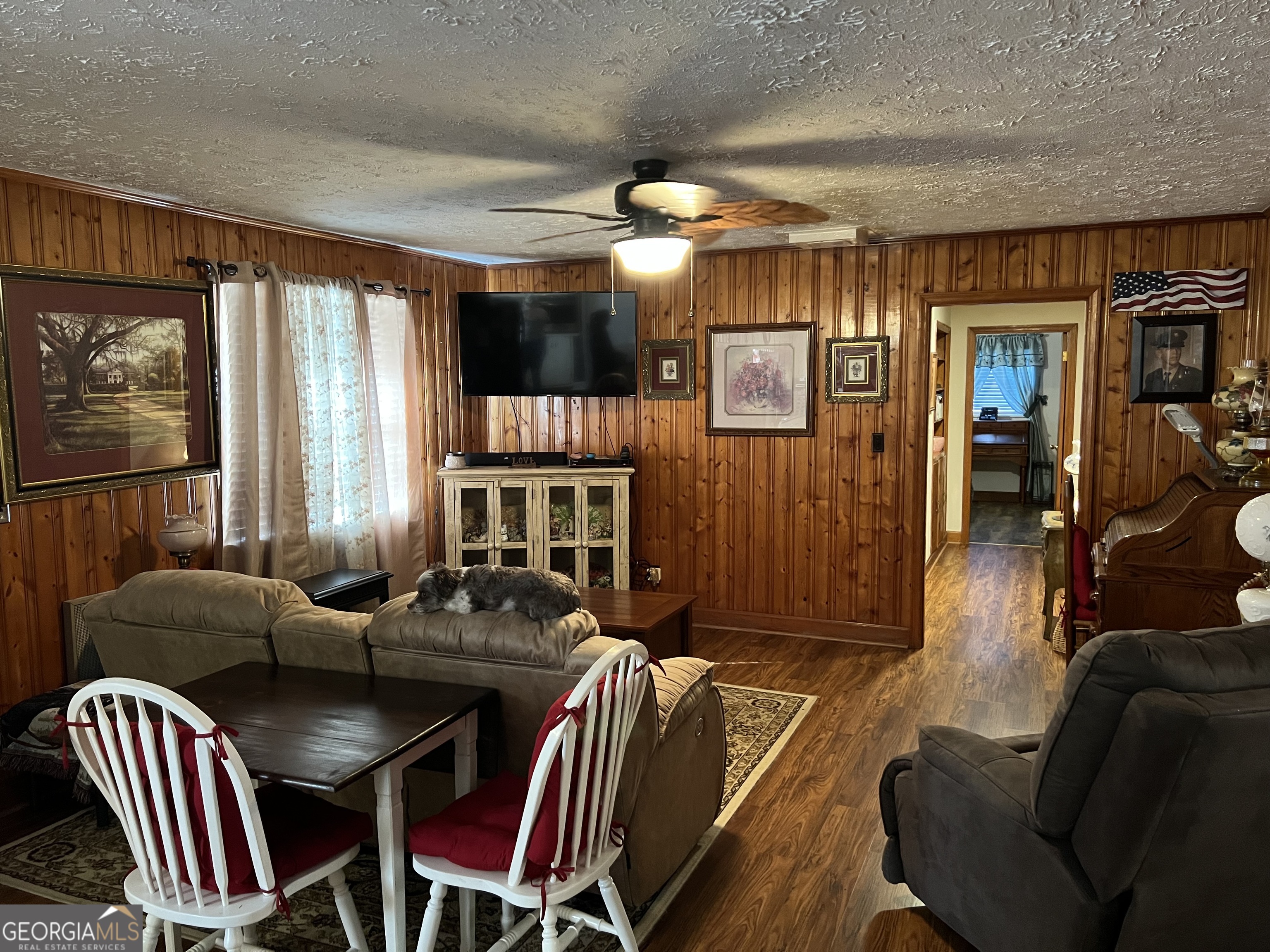 6419 Cochran Highway Cochran, GA 31014 - Photo 7 of 55 a living room with furniture a large window and a chandelier