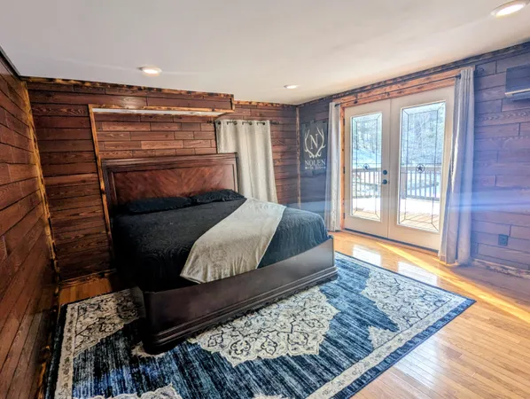 a view of entryway with wooden floor and stairs