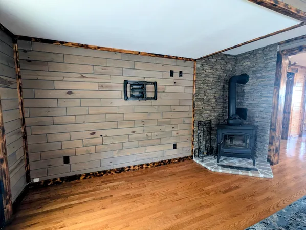 a kitchen with stainless steel appliances granite countertop a stove a sink and a wooden floors