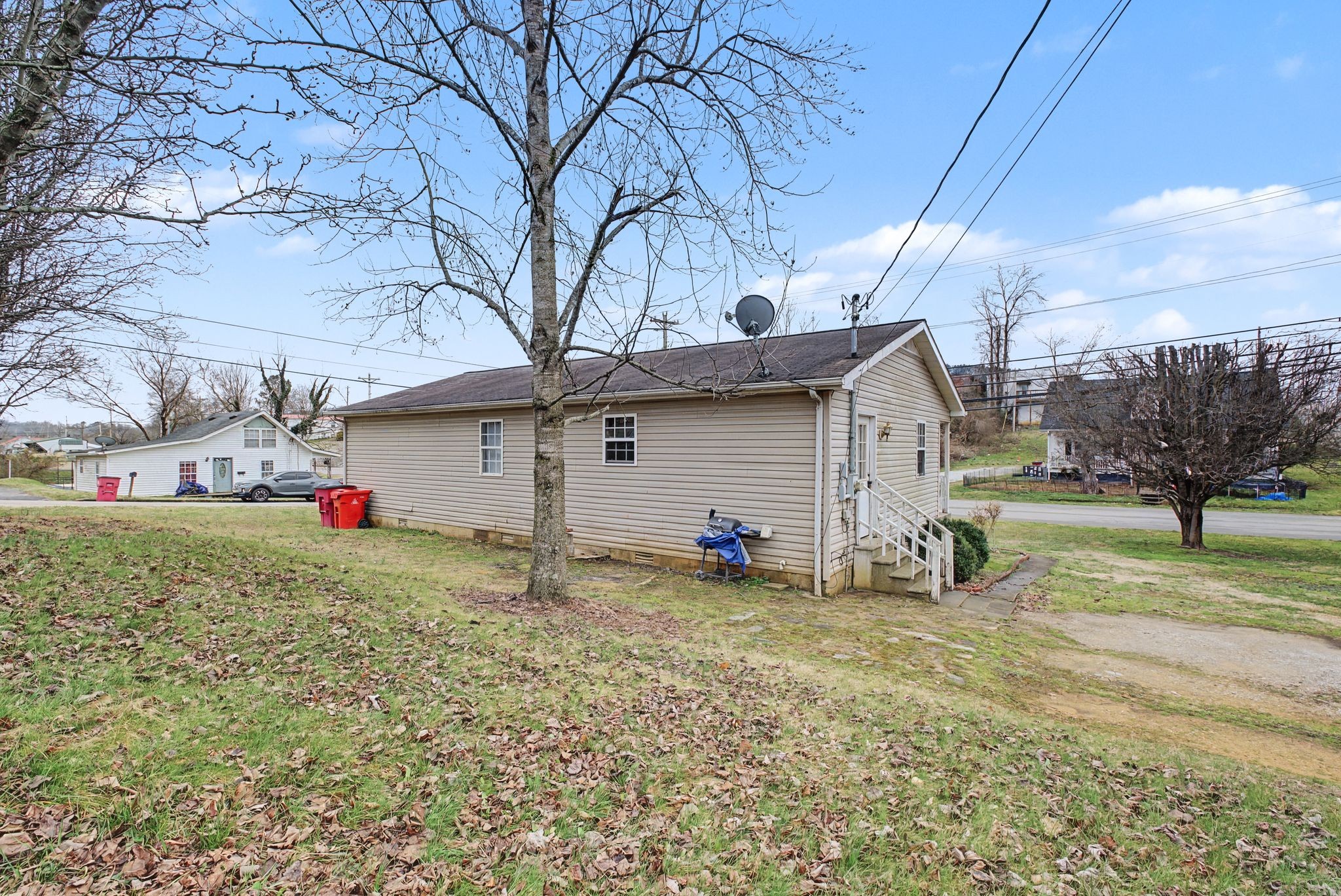 178 Spring Street Carthage, TN 37030 - Photo 24 of 27 a view of a house with a yard