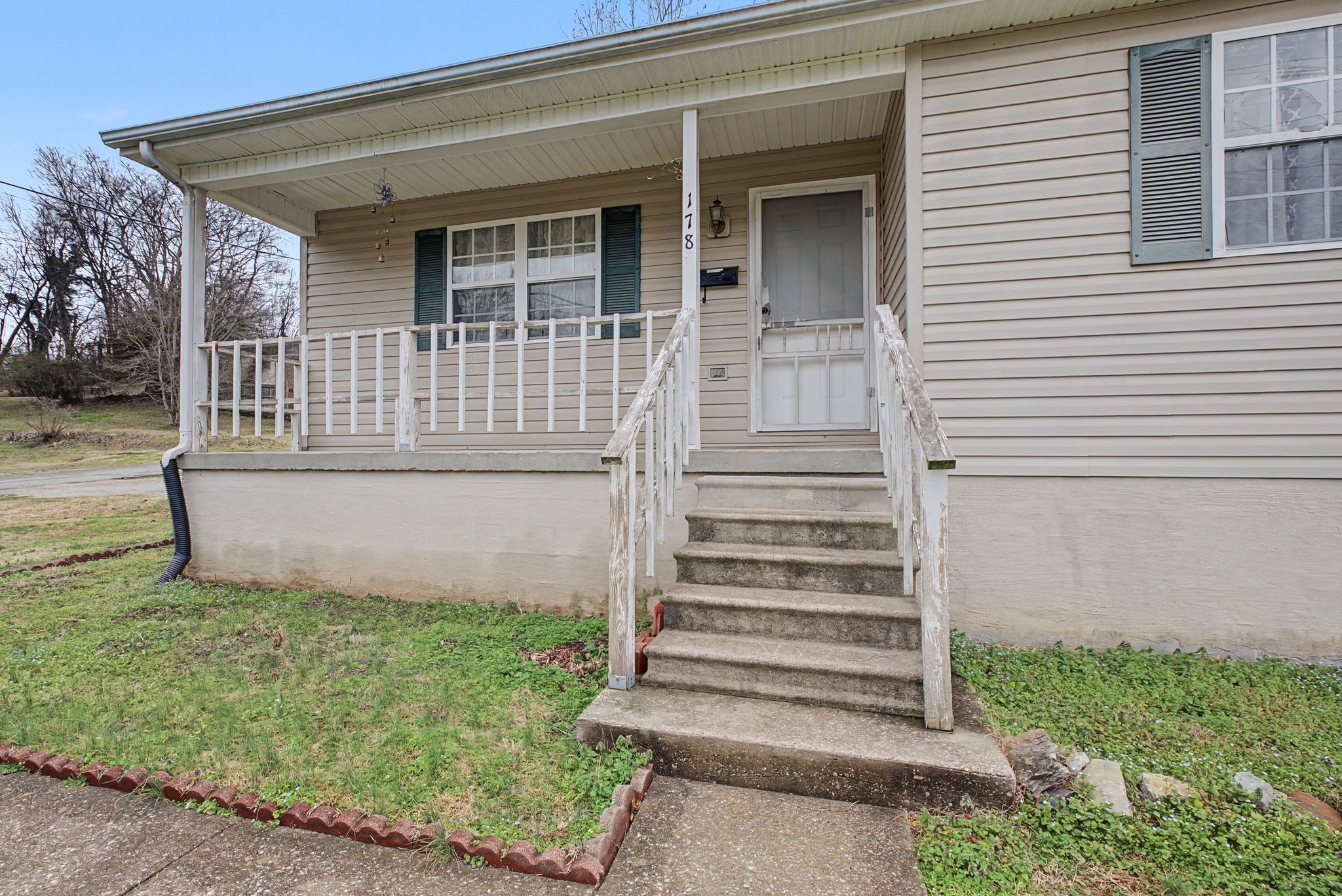 178 Spring Street Carthage, TN 37030 - Photo 4 of 27 a front view of a house with a garden