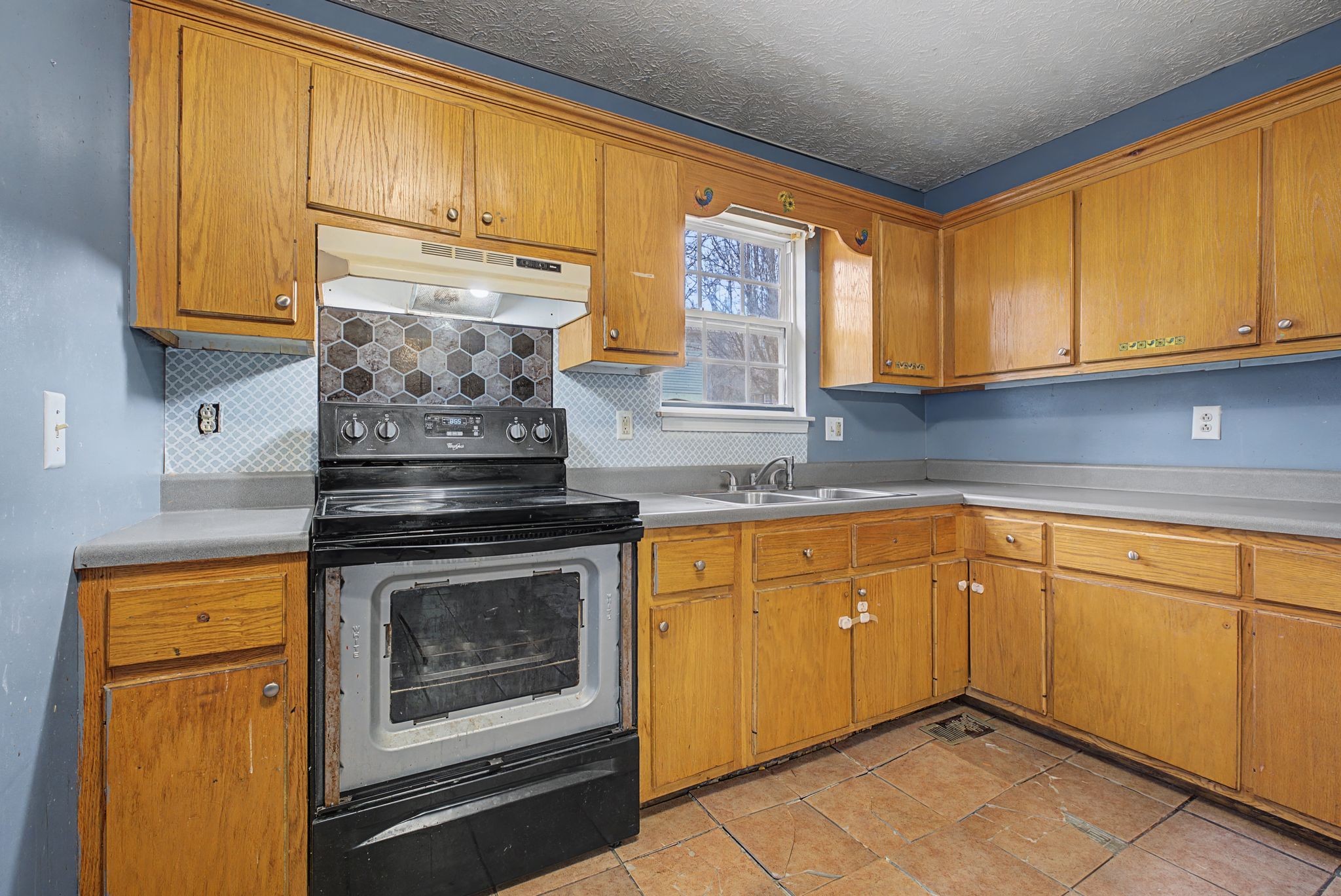 178 Spring Street Carthage, TN 37030 - Photo 10 of 27 a kitchen with stainless steel appliances granite countertop cabinets and a stove top oven