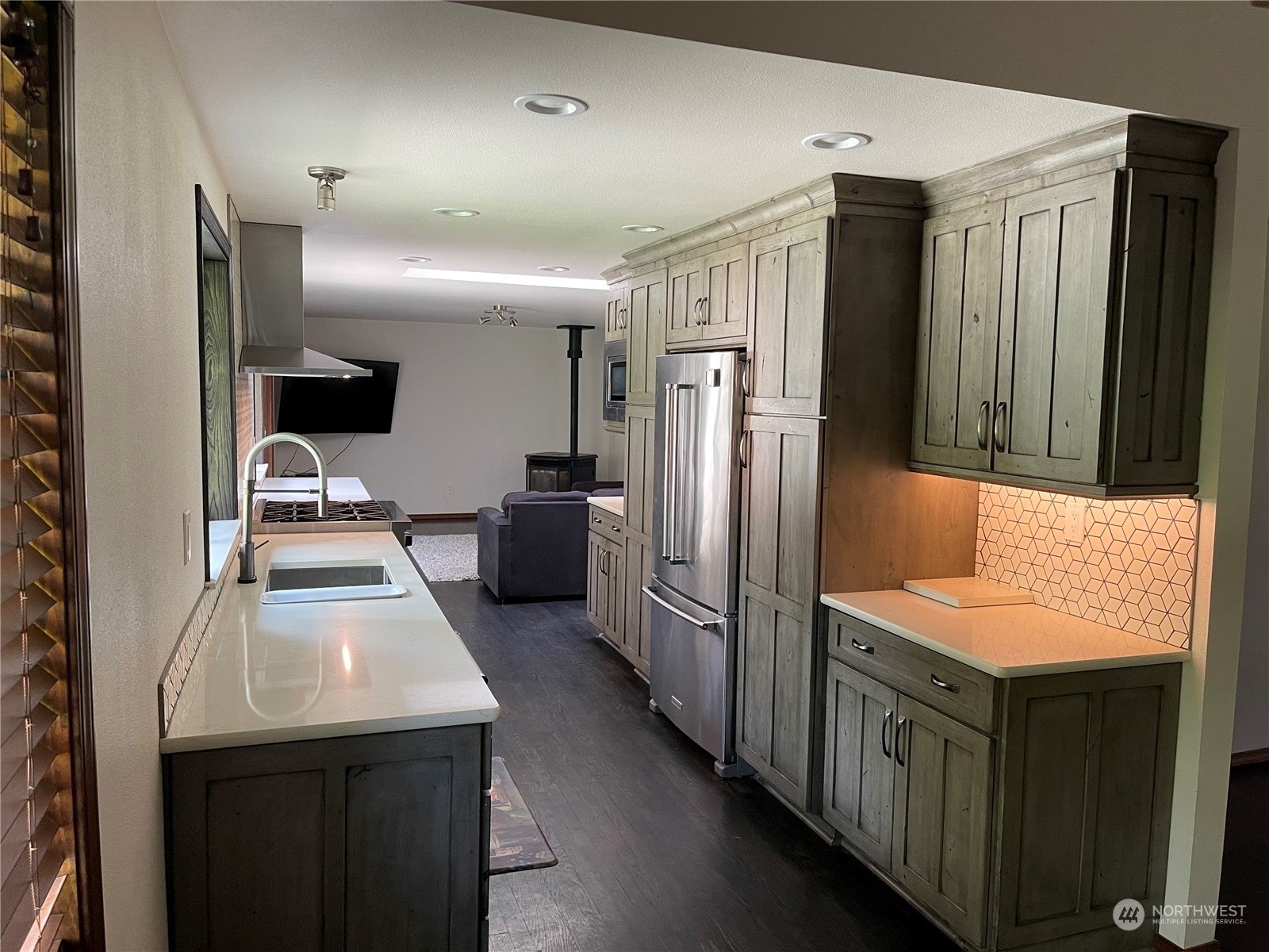 21012 Southeast 159th Street Renton, WA 98059 - Photo 3 of 21 a kitchen with stainless steel appliances granite countertop a refrigerator a sink and a stove