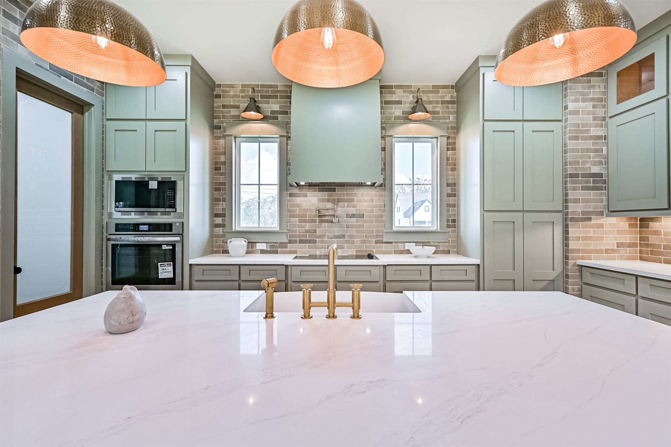 208 Pony Trail Angleton, TX 77515 - Photo 15 of 50 a kitchen with stainless steel appliances kitchen island granite countertop a stove and cabinets