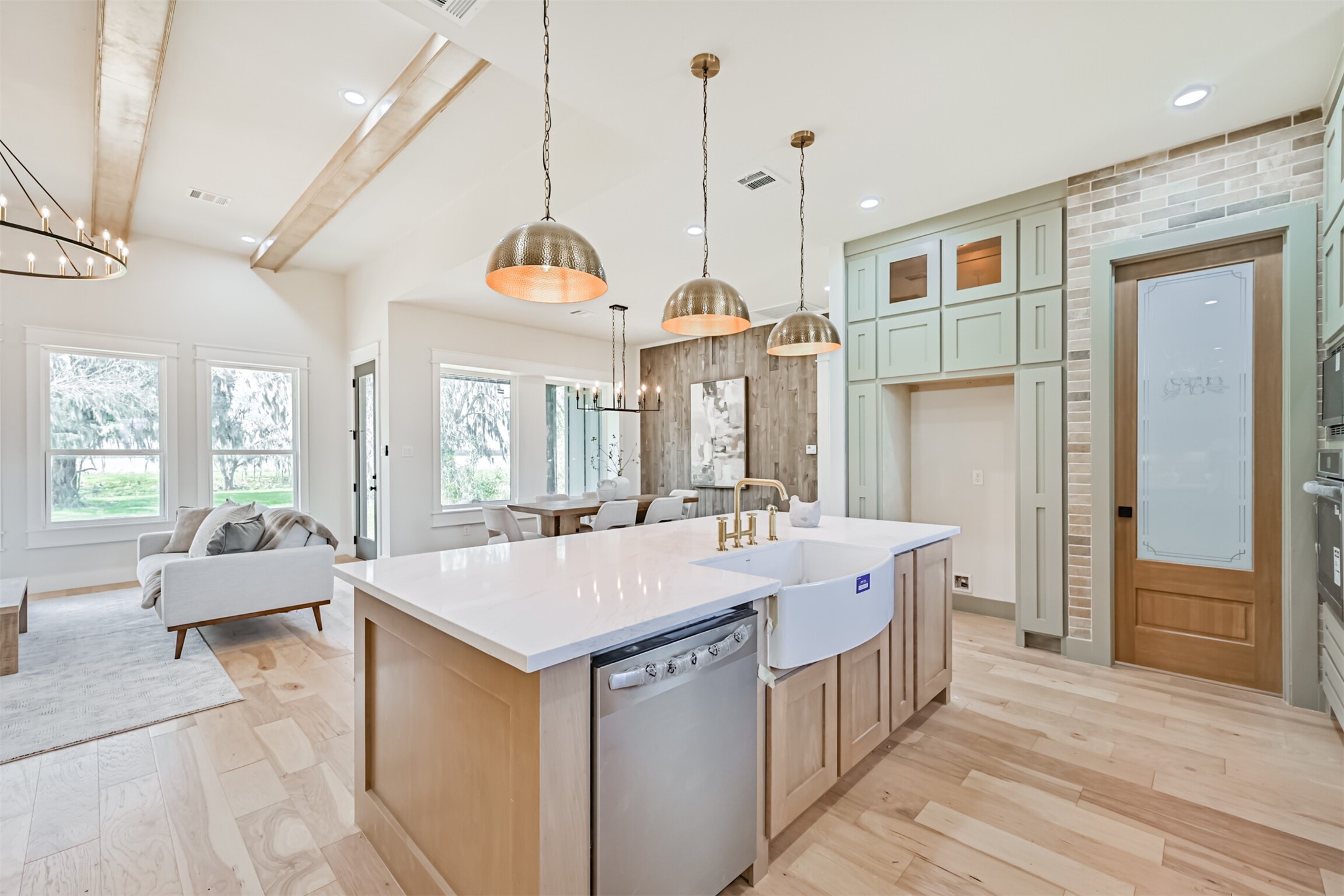 208 Pony Trail Angleton, TX 77515 - Photo 18 of 50 a large kitchen with kitchen island a large island in it
