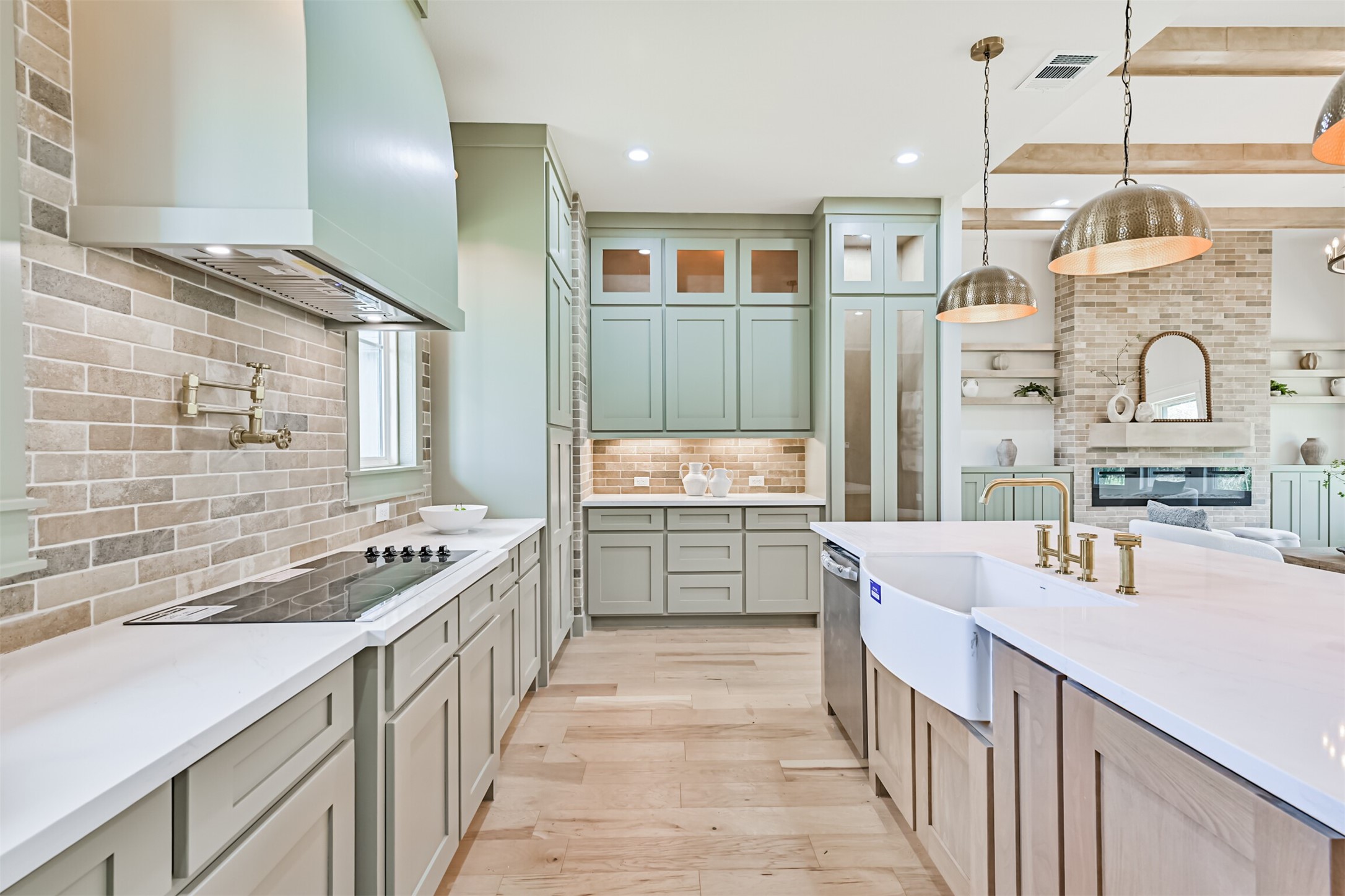 208 Pony Trail Angleton, TX 77515 - Photo 19 of 50 a kitchen with kitchen island a sink stove and cabinets