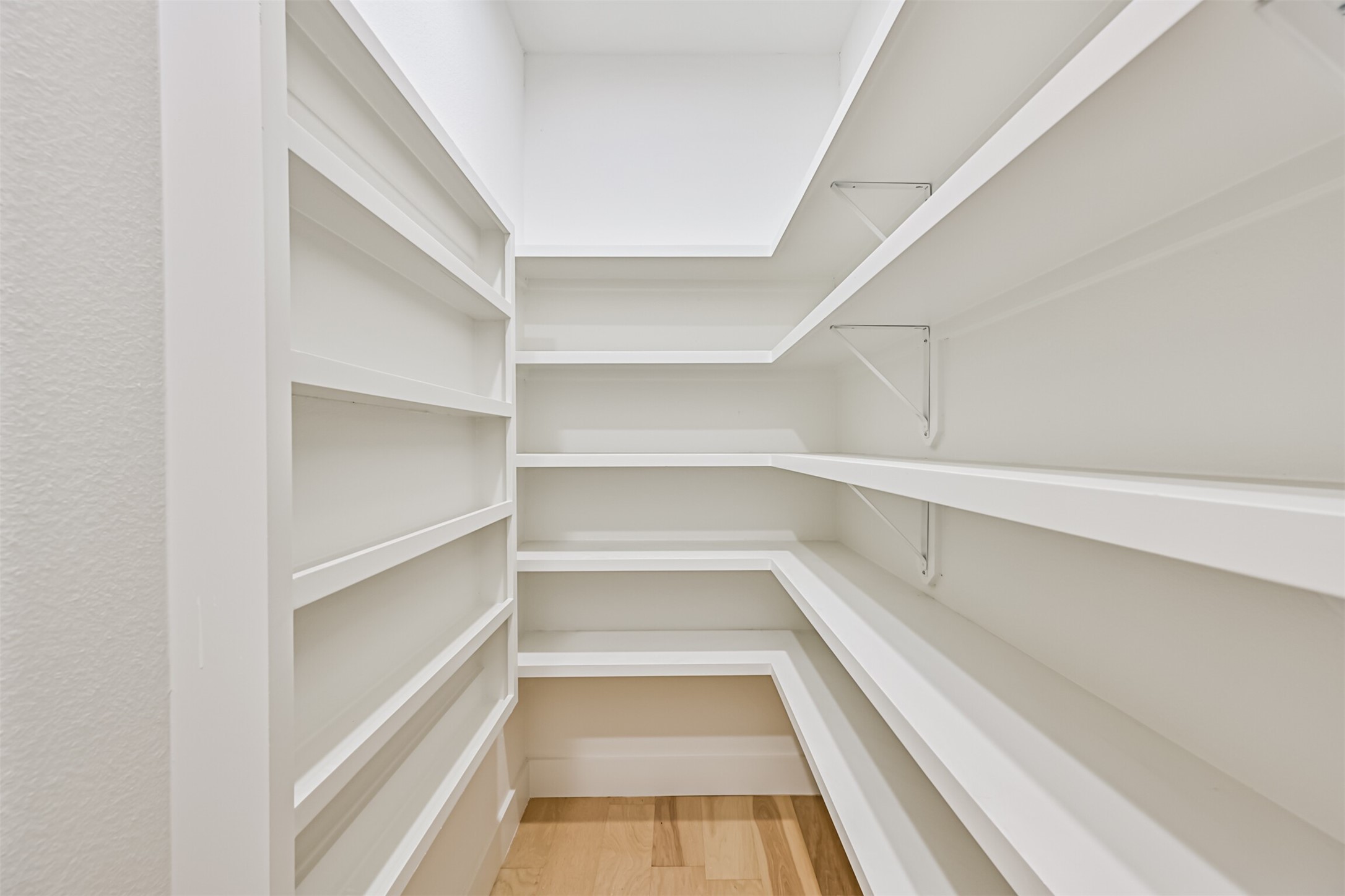 208 Pony Trail Angleton, TX 77515 - Photo 21 of 50 a view of a room with shelves