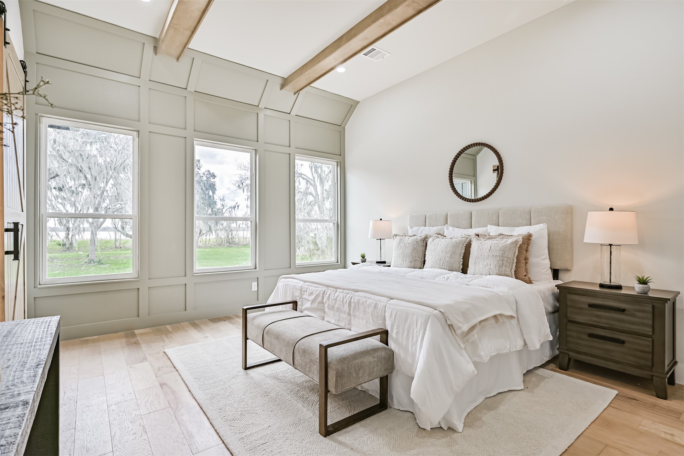 208 Pony Trail Angleton, TX 77515 - Photo 29 of 50 a bedroom with bed and a large window