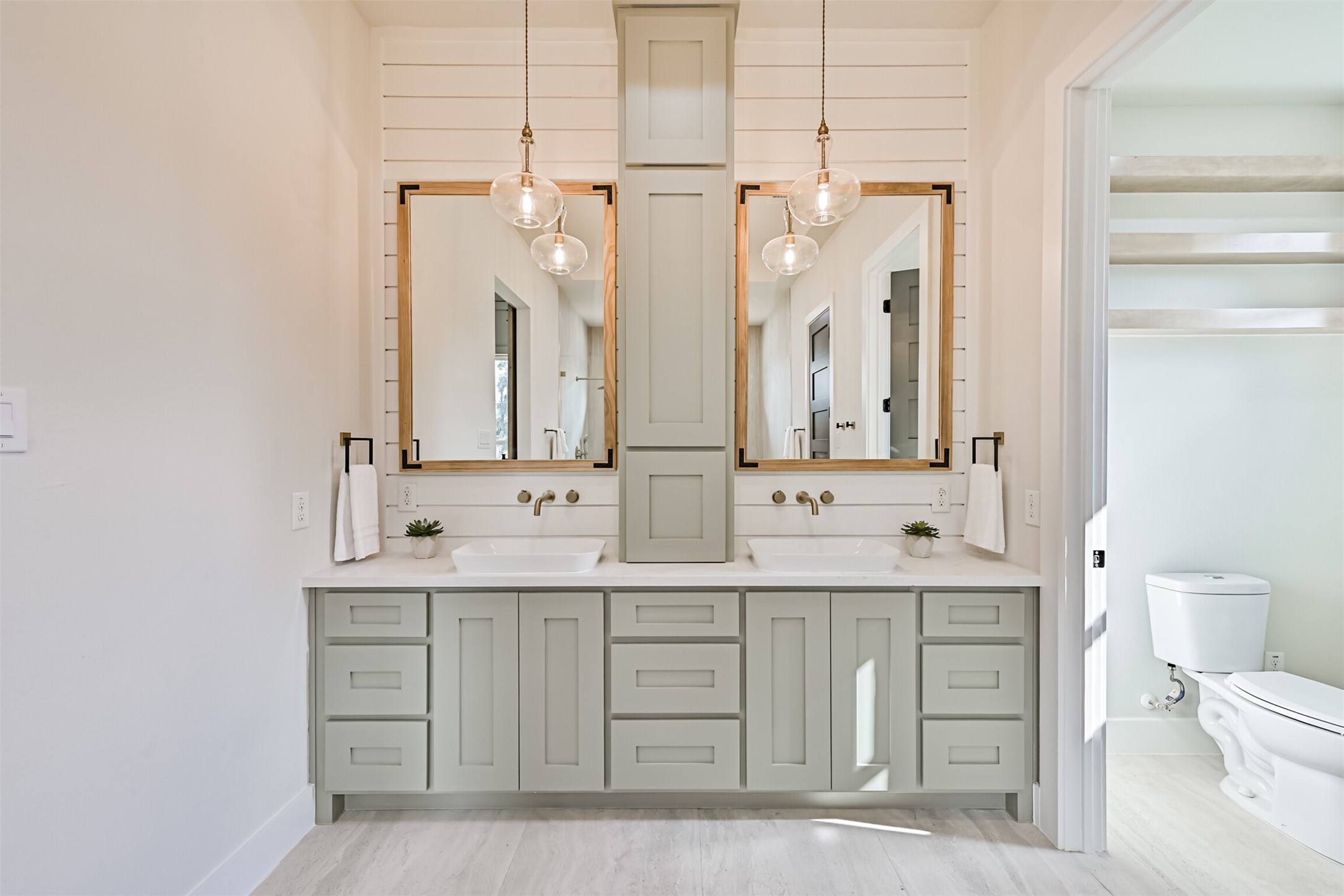 208 Pony Trail Angleton, TX 77515 - Photo 34 of 50 a bathroom with a double vanity sink mirror and toilet