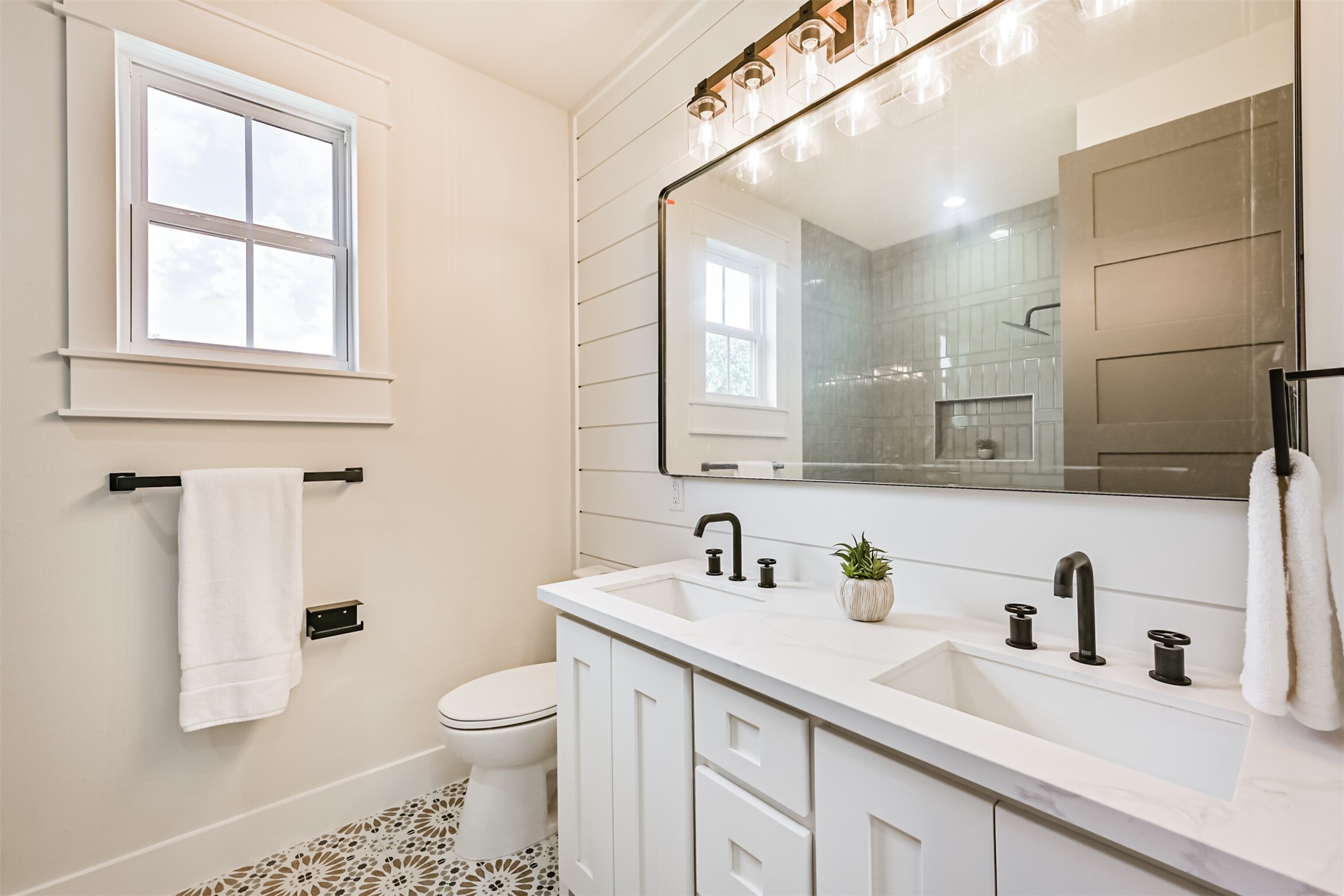208 Pony Trail Angleton, TX 77515 - Photo 42 of 50 a bathroom with a sink a toilet and a mirror
