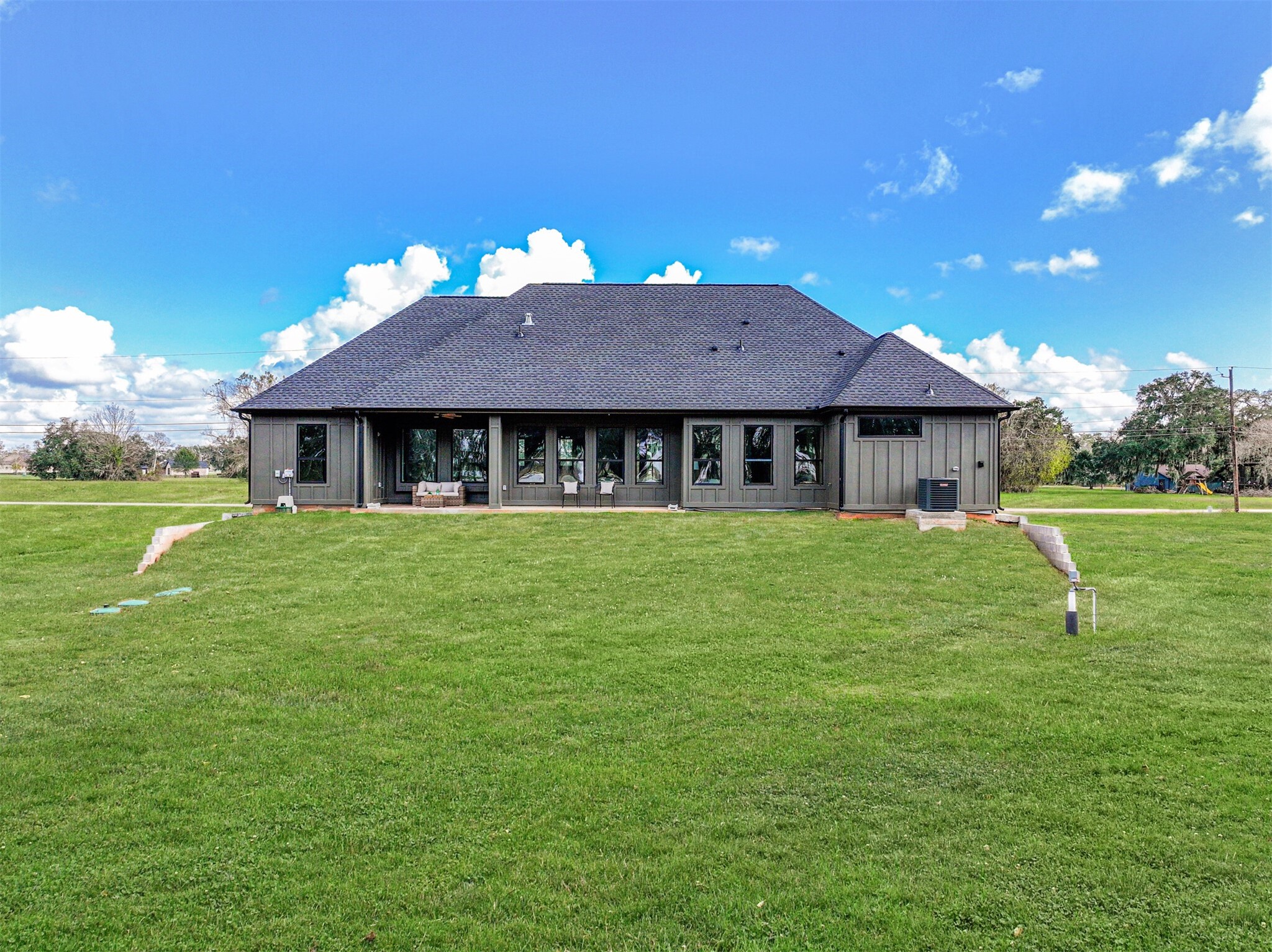208 Pony Trail Angleton, TX 77515 - Photo 48 of 50 a house with swimming pool in front of it