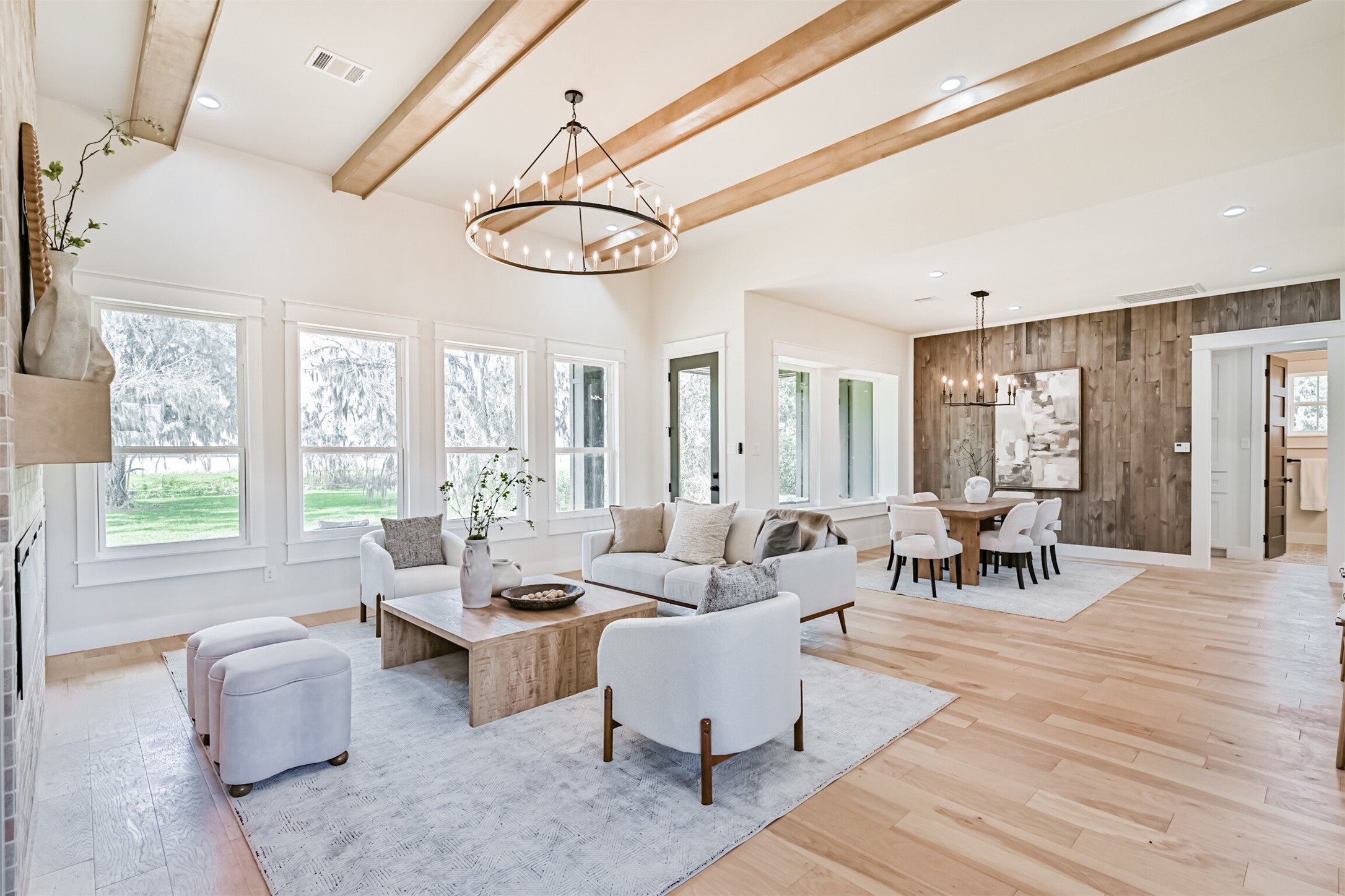 208 Pony Trail Angleton, TX 77515 - Photo 6 of 50 a living room with furniture a wooden floor and a large window