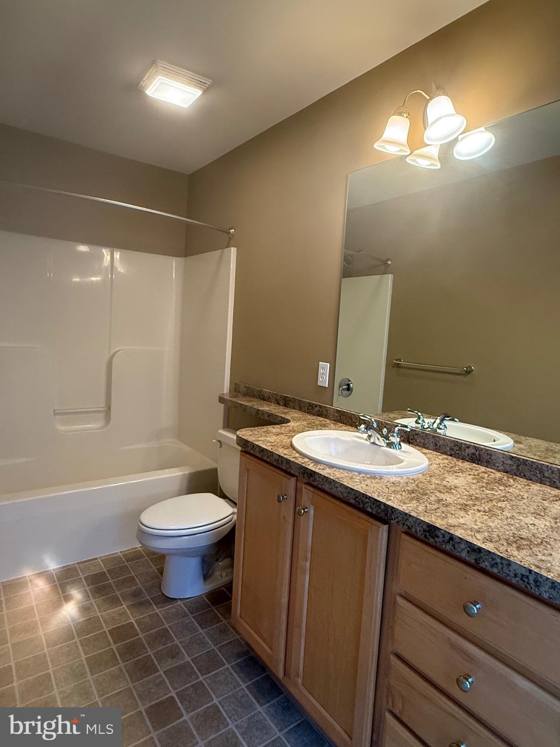 2082 Deer Run Drive Hummelstown, PA 17036 - Photo 12 of 27 a bathroom with a granite countertop sink mirror vanity and toilet