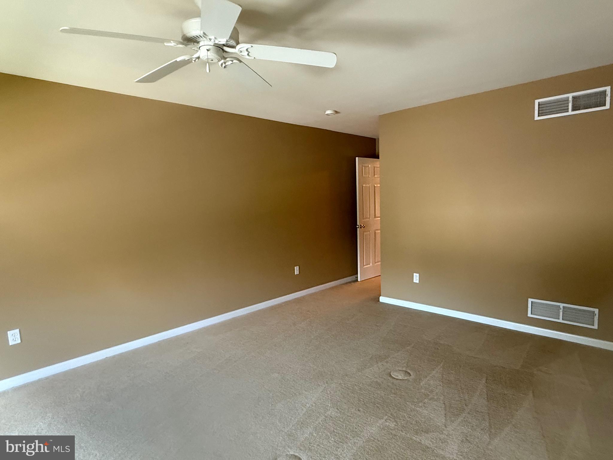 2082 Deer Run Drive Hummelstown, PA 17036 - Photo 18 of 27 an empty room with a ceiling fan and carpet