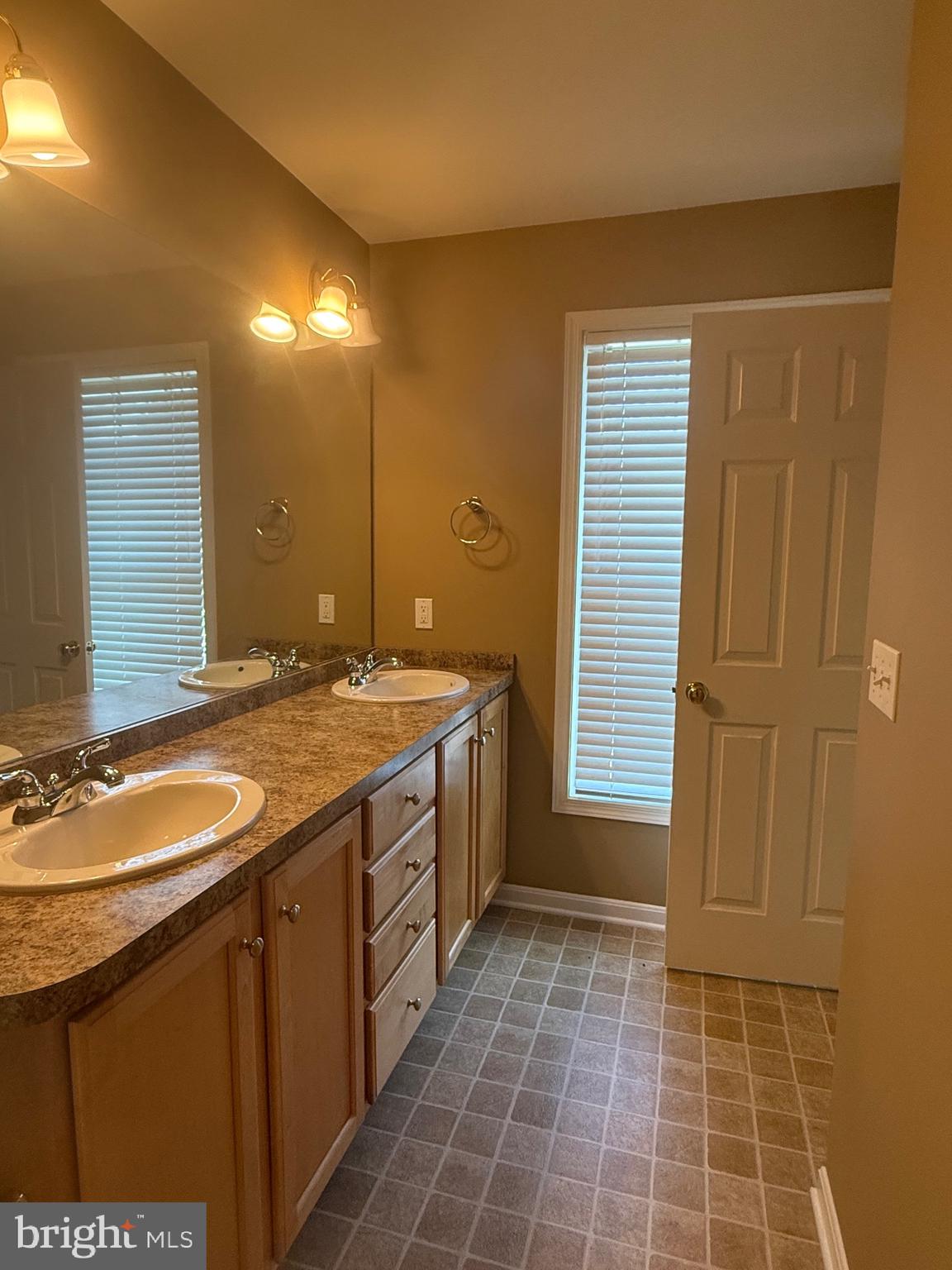 2082 Deer Run Drive Hummelstown, PA 17036 - Photo 22 of 27 a bathroom with a granite countertop sink a toilet and a mirror