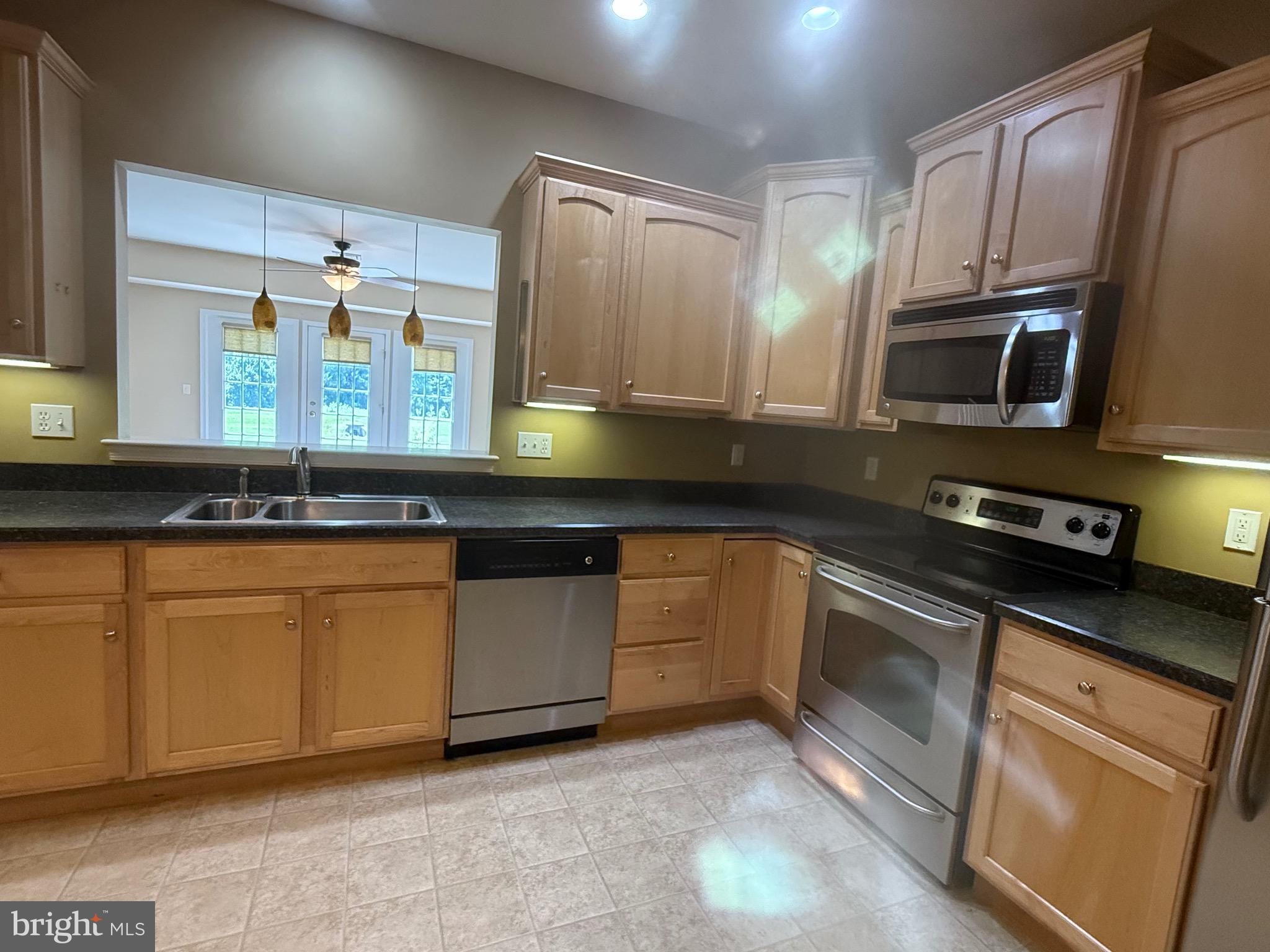 2082 Deer Run Drive Hummelstown, PA 17036 - Photo 5 of 27 a kitchen with granite countertop stainless steel appliances and cabinets