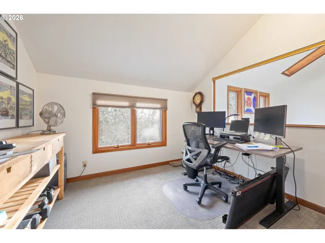 a workspace with furniture and a window
