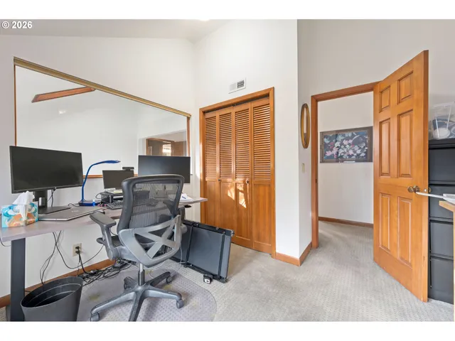 a workspace with furniture and a window