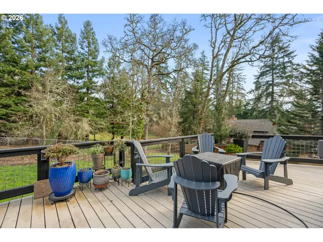 a view of sitting area with furniture on wooden deck