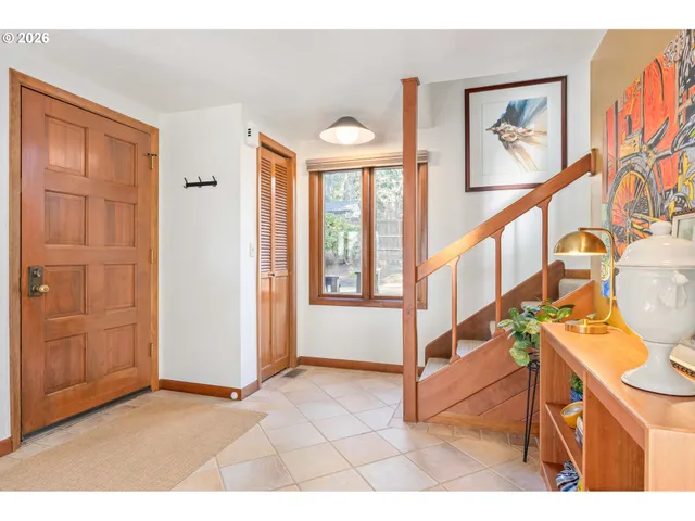 a view of an entryway with wooden floor