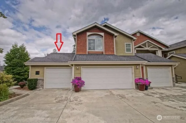 a front view of a house with a garage