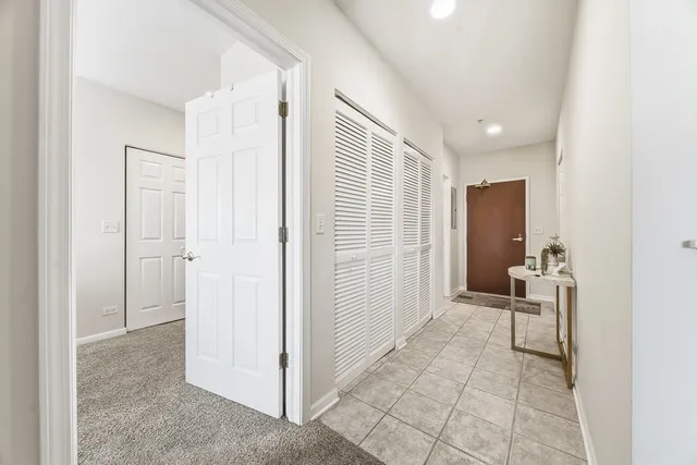 a view of a livingroom with furniture and front door