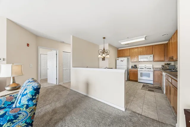 a kitchen with furniture a sink and a stove