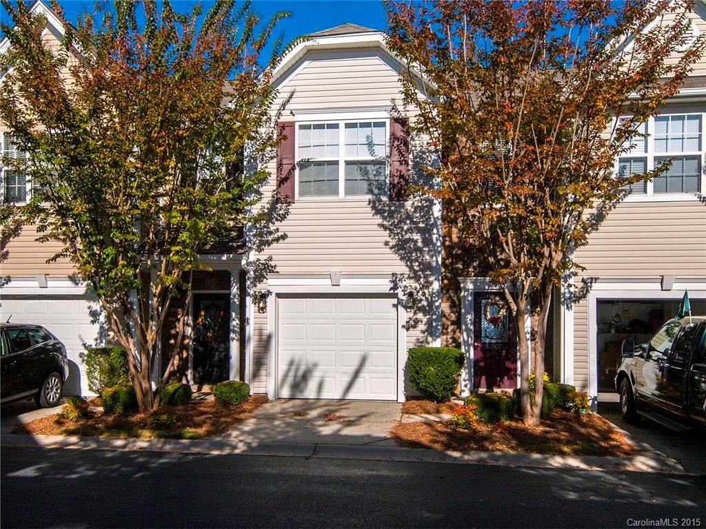 1907 Travertine Lane, Unit 209 Fort Mill, SC 29708 - Photo 1 of 18 a front view of a house with a yard