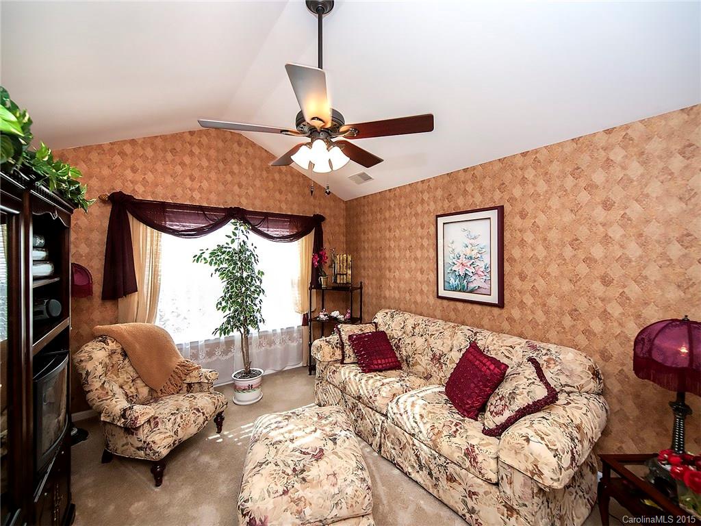 1907 Travertine Lane, Unit 209 Fort Mill, SC 29708 - Photo 13 of 18 a bedroom with furniture and a window