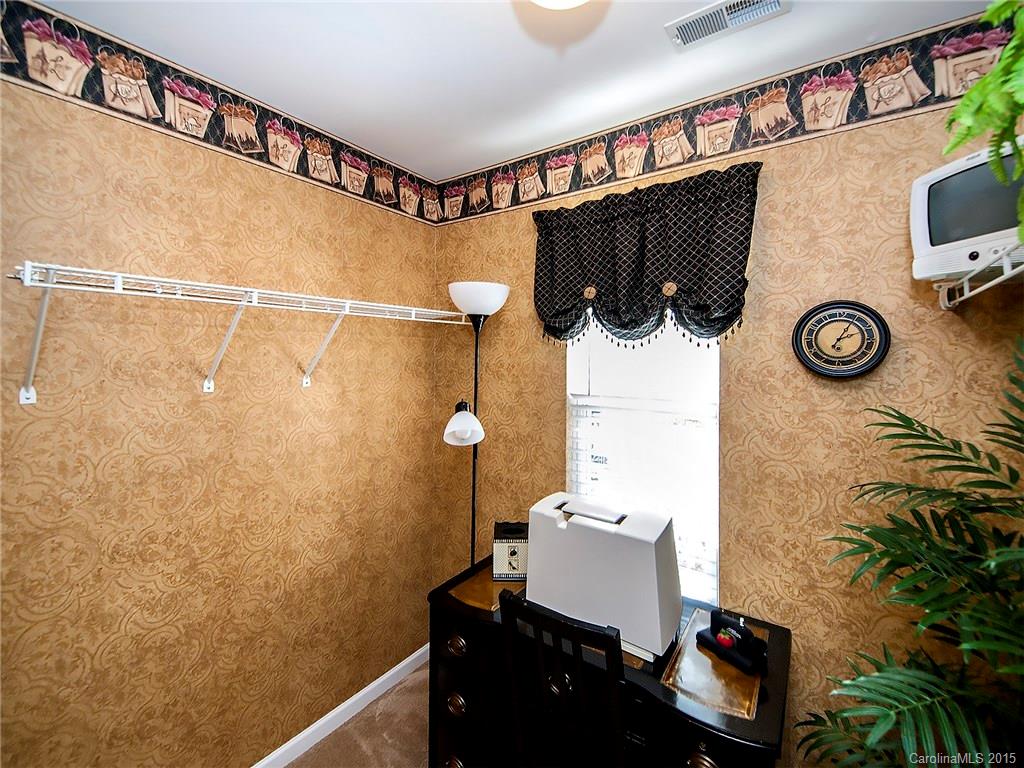 1907 Travertine Lane, Unit 209 Fort Mill, SC 29708 - Photo 15 of 18 a bathroom with a sink and a mirror