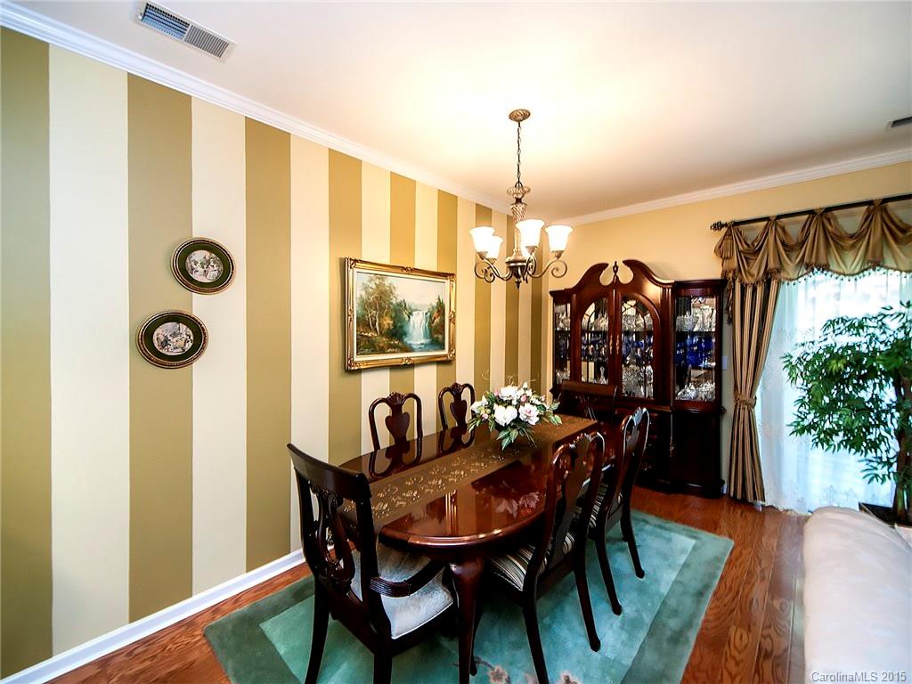 1907 Travertine Lane, Unit 209 Fort Mill, SC 29708 - Photo 5 of 18 a view of a dining room with furniture and window